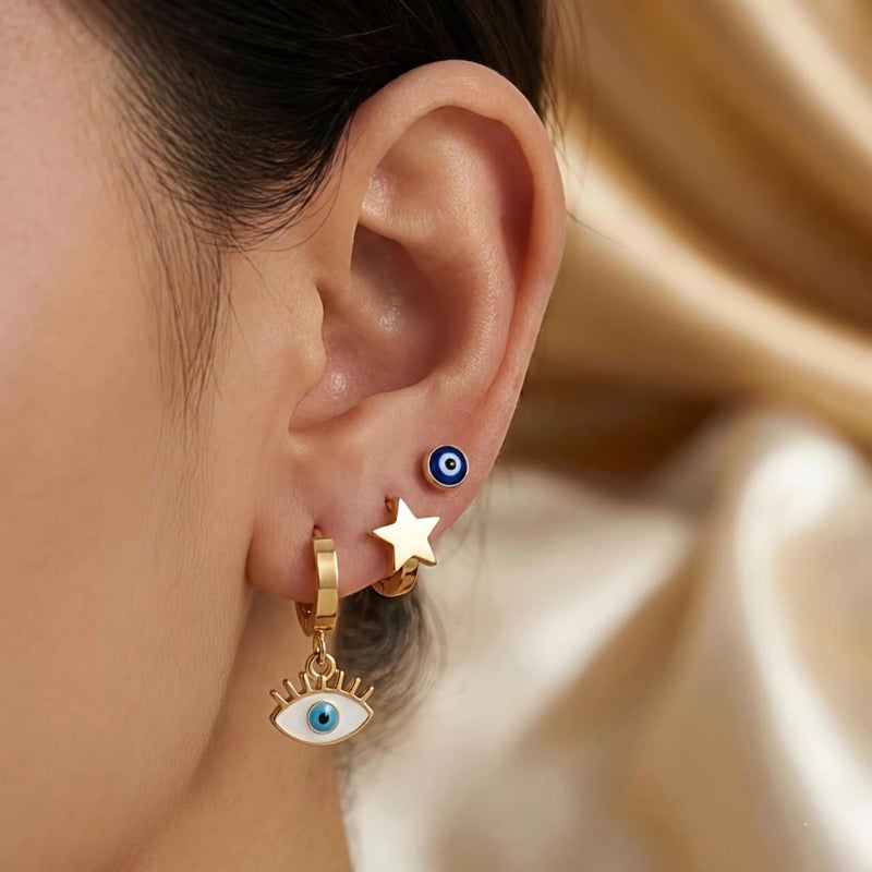 طقم ٣ أزواج حلقان ذهبي مميز: بريمة العين الزرقاء، النجمة الذهبية، وعين الرموش البيضاء. من الستانلس ستيل المقاوم للصدأ، تشكيلة تجمع بين الرقة والفخامة. - Image 2